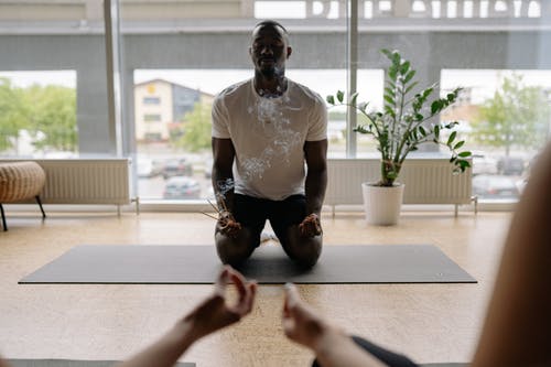 male instructor meditating